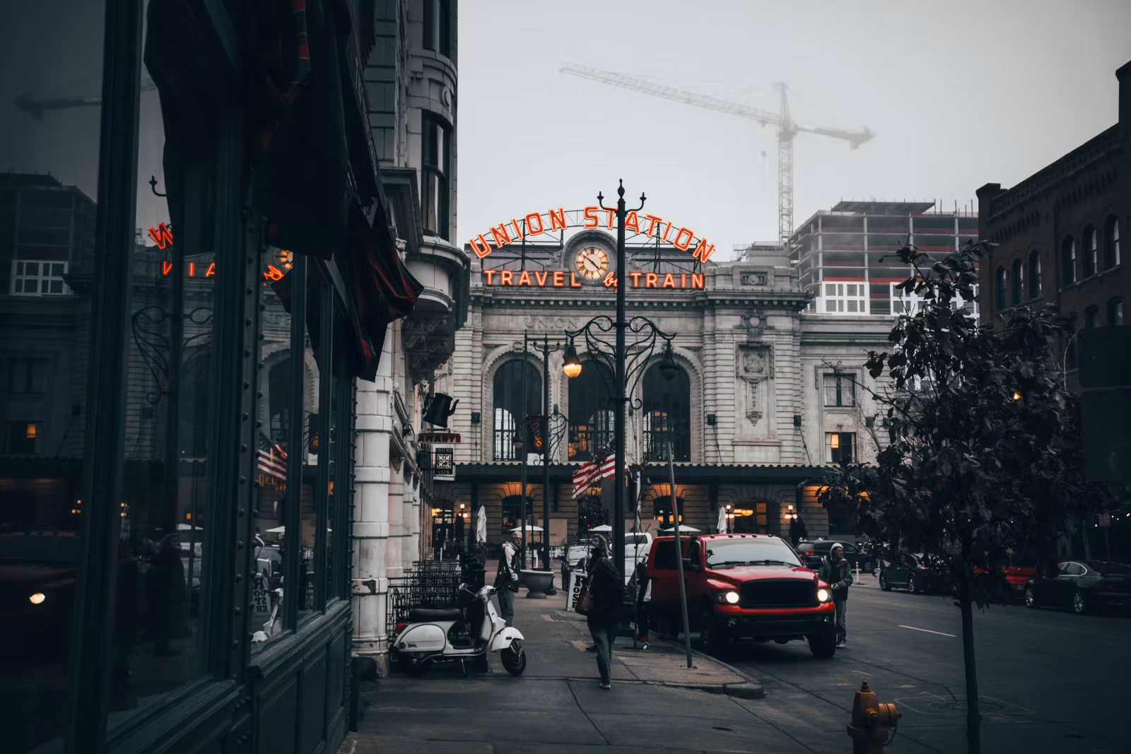 Union Station in Denver, Colorado, with street view, cars on a foggy day