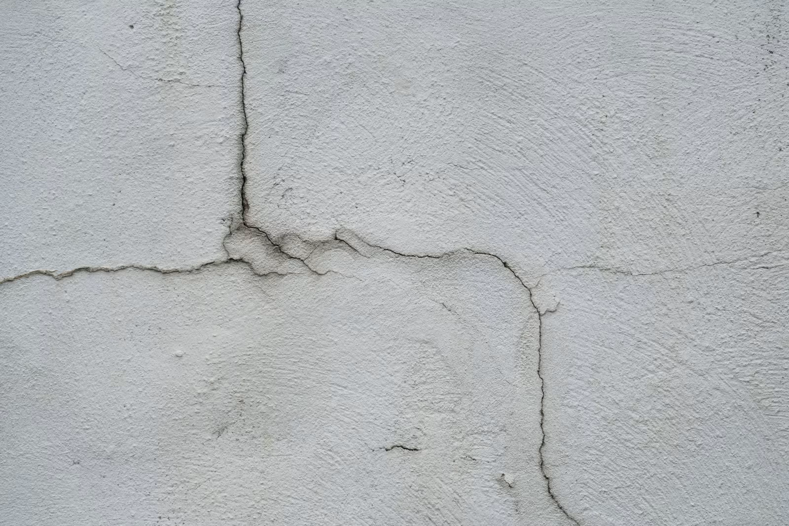 Photograph of siding and stucco failure
